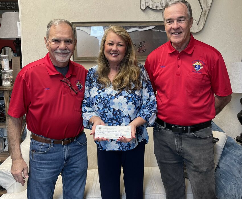 Teresa Sawyer is pictured here with Joe Chessa and Mike McFadden from the Knights of Columbus.